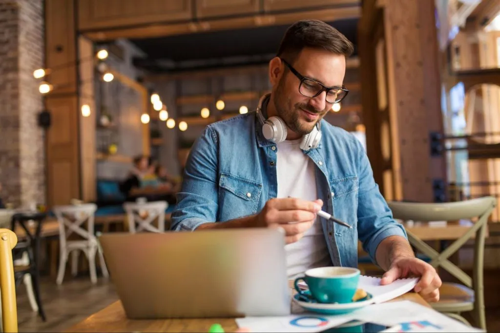 Man Working and Drinking Coffee at a Cafe in Dupont Circle, Washington DC
