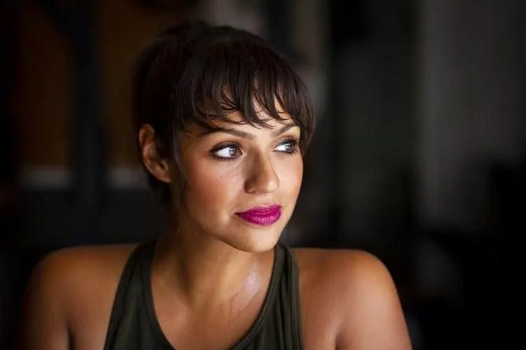 Woman Exhausted From Working Out in Her Apartment