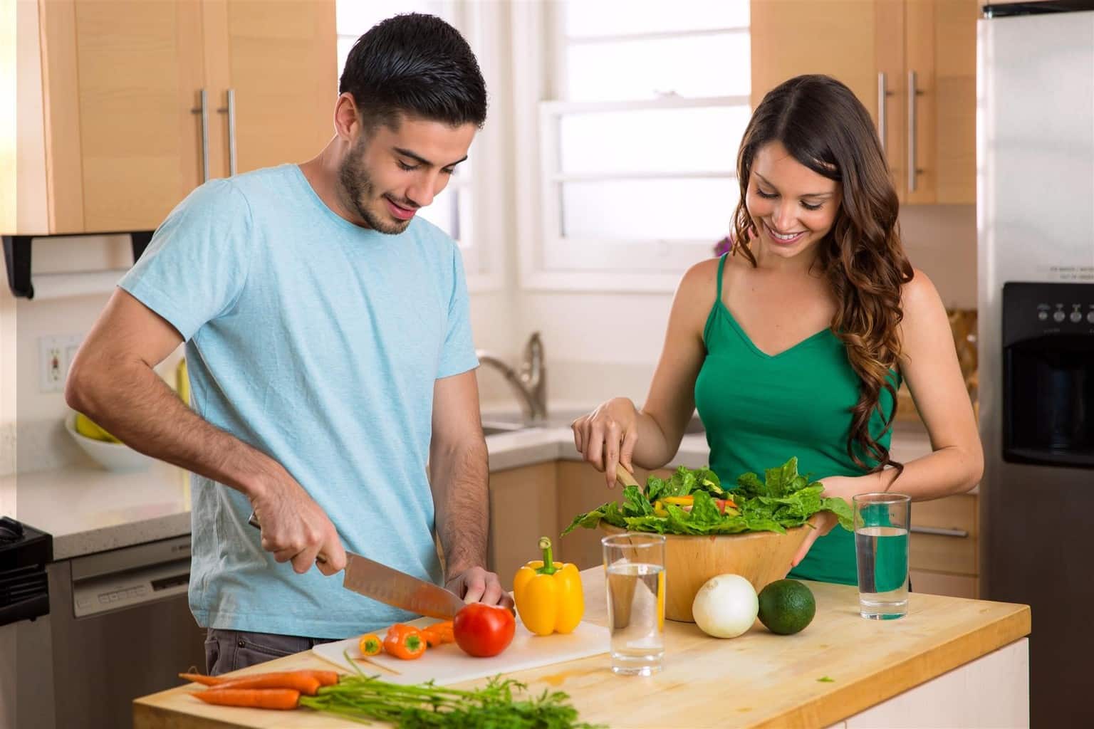 Husband And Wife Cooking Dinner 