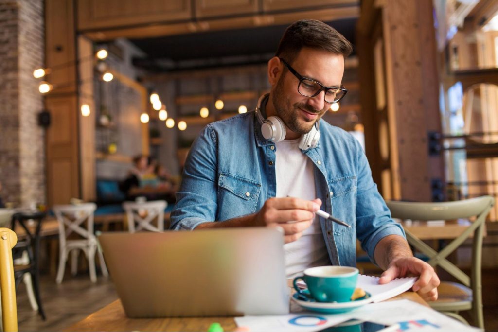 Man Working and Drinking Coffee at a Cafe in Dupont Circle, Washington DC